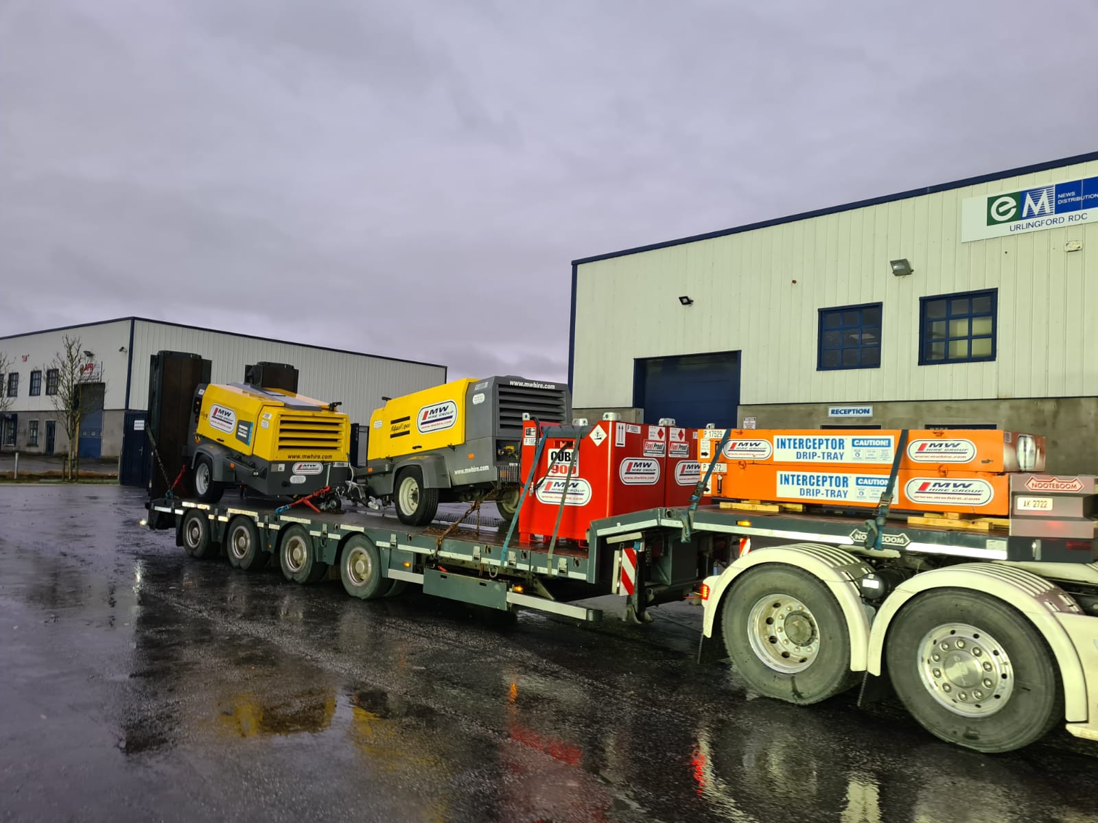 2 400 CFM Atlas Copco compressors plus fuel tanks & Interceptor trays heading on a rental job